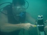 Installation underwater of aquadopp with diver